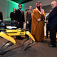 Boston Dynamics founder Marc Raibert shows off a SpotMini robot to Saudi HRS Crown Prince Mohammed bin Salman in March 2018.